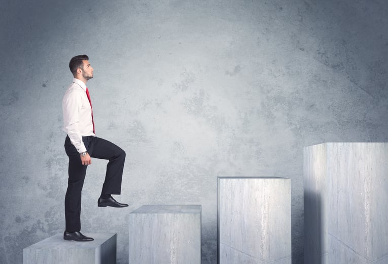 Business person stepping up a staircase-1