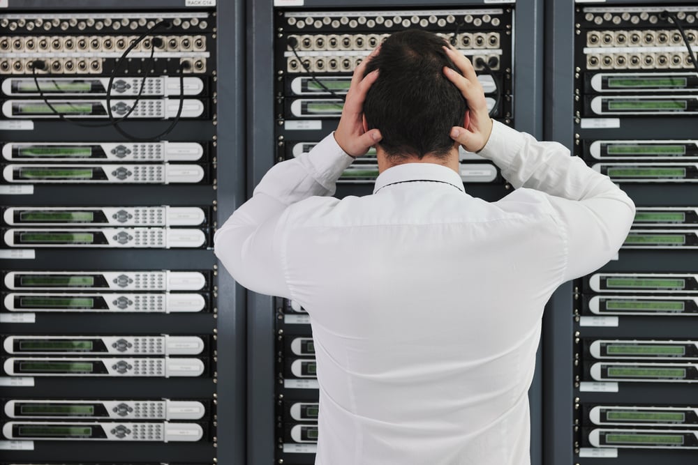 business man in network server room have problems and looking for  disaster solution-1